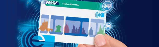a hand holding the eTicket card, blue background