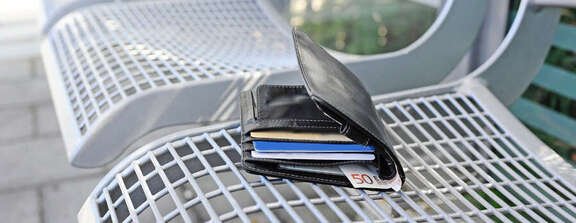 Wallet on a bench on the platform