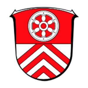 Wappen Main-Taunus-Kreis: Oben ein silbernes Mainzer Rad auf rotem Grund, unten drei rote Sparren auf silbernem Grund.